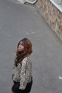 Young woman standing on street