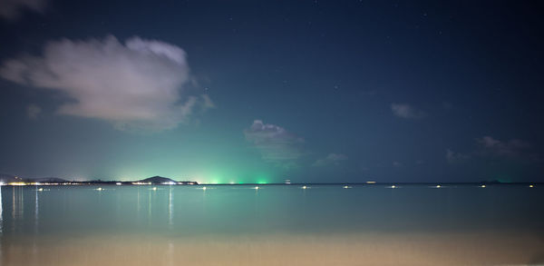 Scenic view of sea against sky at night