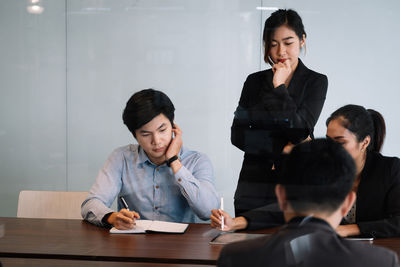 Young couple sitting on table