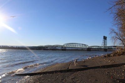 Bridge over river against sky