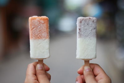 Hand holding ice cream cone