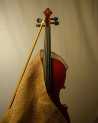 Close-up of guitar against white background