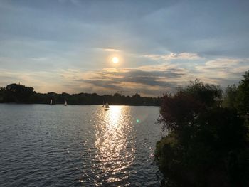 Scenic view of lake against sky during sunset