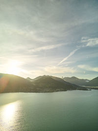 Dawn in the mountains with lake in the foreground