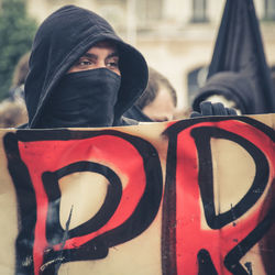 Close-up portrait of man wearing mask