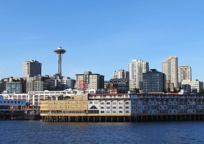 Modern buildings in city against clear sky