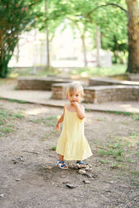 Full length of woman with arms outstretched