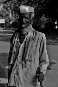 Portrait of man standing outdoors