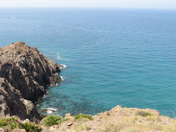 High angle view of sea shore against sky