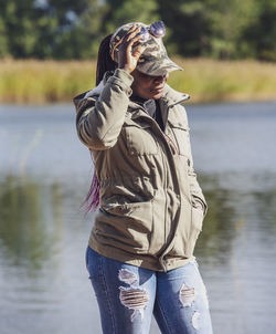 African woman wearing autumn clothes on a sunny september day on the swedish coast