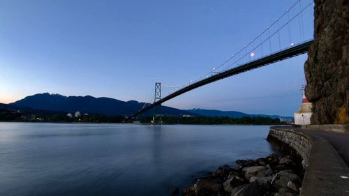 Bridge over river against sky