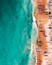 High angle view of people enjoying at beach