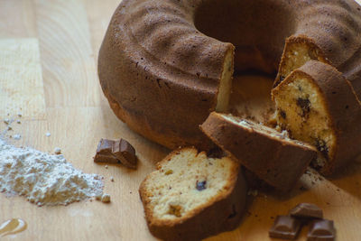 Close-up of chocolates and cake on cutting board