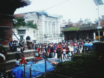 People at town square against sky