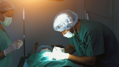 Rear view of man with daughter at home