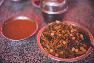 High angle view of chopped coffee in bowl on table