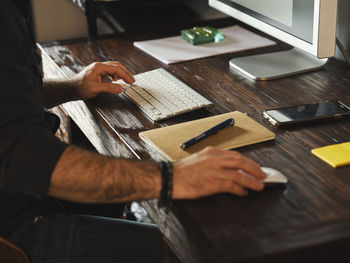 High angle view of man working on table