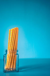 Close-up of food on table against blue background