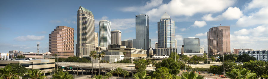 Panoramic view of buildings in city against sky