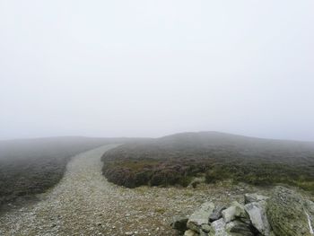 Scenic view of mountains during foggy weather