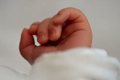 Cropped hand of baby