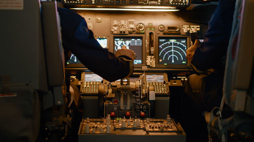 Midsection of man using sound mixer