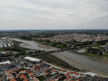 High angle view of buildings in city against sky