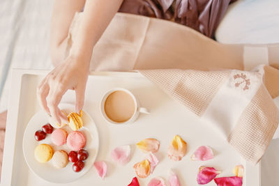 High angle view of woman preparing food on table