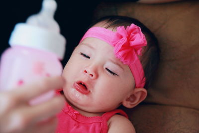 High angle view of girl crying at home