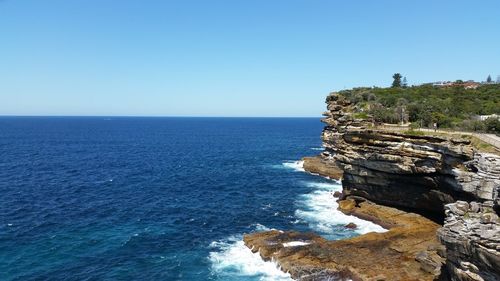 Scenic view of sea against blue sky