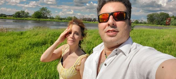 Portrait of young man wearing sunglasses outdoors