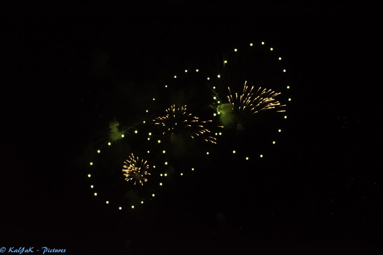 LOW ANGLE VIEW OF FIREWORKS EXPLODING