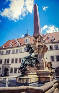 Low angle view of statue against cloudy sky