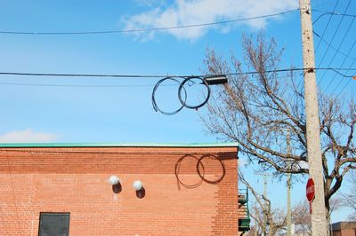 Low angle view of basketball hoop against sky