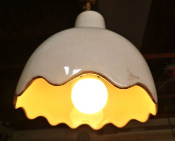 Low angle view of illuminated light bulb