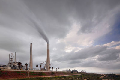 Power plant and a cloudy sky during a stormy day