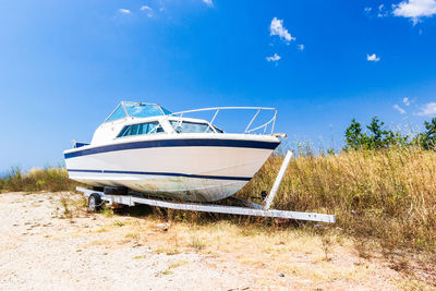 Old boat on sandy beach on coastline of adriatic sea, montenegro