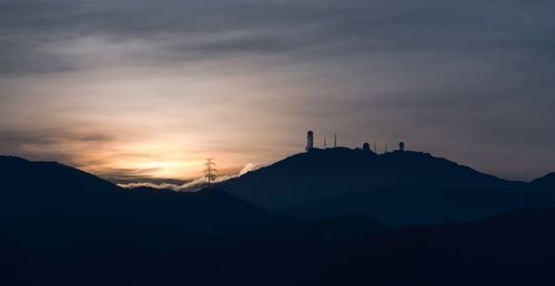 Low angle view of silhouette mountain against sky