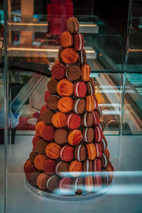 Macaroons stacked in plate for display at store