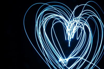 Heart shape drawn by light painting at night