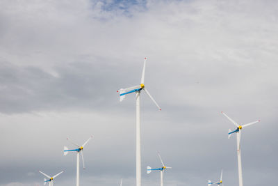 Low angle view of wind turbine against sky