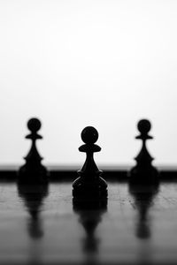 Close-up of chess pieces on table