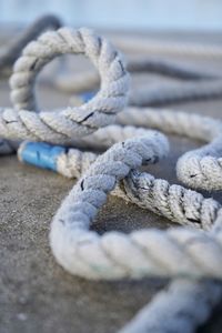 Close-up of rope tied on metal