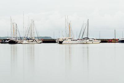 View of the harbour with sailboats moored. long exposure view with reflections on water