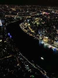 High angle view of illuminated buildings in city at night