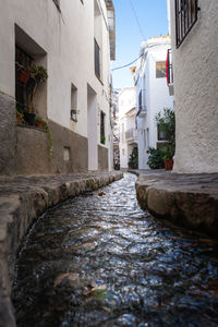 Footpath amidst buildings