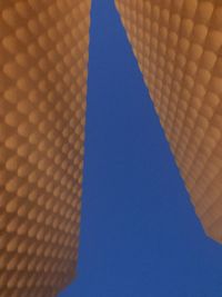 Low angle view of building against clear blue sky