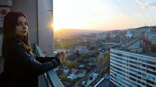 Woman looking at cityscape