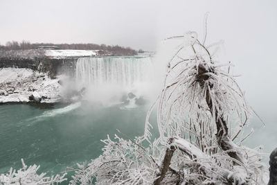 Scenic view of frozen lake against sky