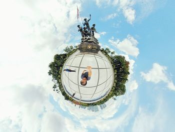 Low angle view of statue against cloudy sky